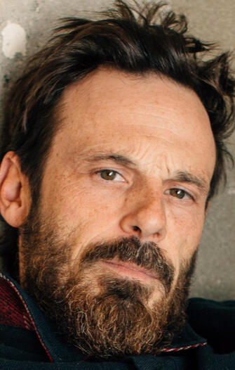 Scoot McNairy - Father Charles Watkins